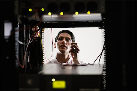 simsearch:693-03304665,k - Technician working on the server Stock Photo - Premium Royalty-Free, Code: 6109-08389891