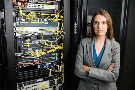 data center person - Confident technician looking at camera Stock Photo - Premium Royalty-Free, Code: 6109-08389838