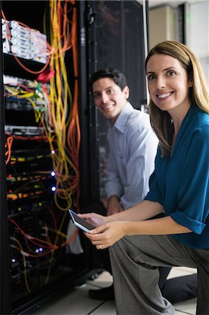 data center male female - Team of technicians working together on servers Stock Photo - Premium Royalty-Free, Code: 6109-08389902