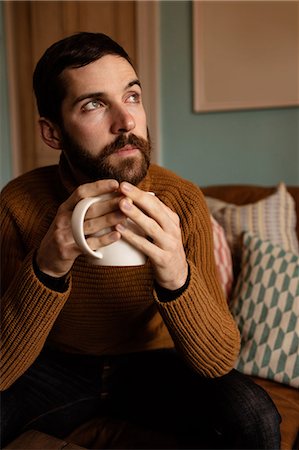 simsearch:6109-08390353,k - Handsome hipster relaxing on couch Stock Photo - Premium Royalty-Free, Code: 6109-08390048