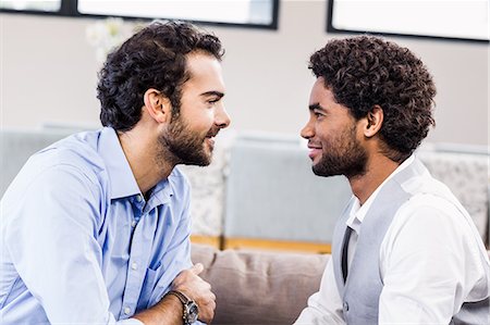 simsearch:6109-08390233,k - Happy gay couple looking to each other Stock Photo - Premium Royalty-Free, Code: 6109-08390145