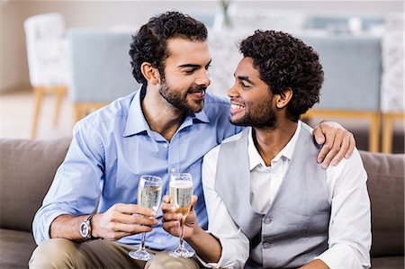 simsearch:6109-08390207,k - Happy gay couple drinking champagne Foto de stock - Sin royalties Premium, Código: 6109-08390152