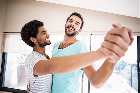 Happy gay couple dancing Fotografie stock - Premium Royalty-Free, Codice: 6109-08390385