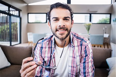 simsearch:6109-08390544,k - Portrait of smiling man holding glasses Stock Photo - Premium Royalty-Free, Code: 6109-08390414