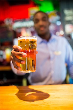 simsearch:832-03640687,k - Glass of beer served by barkeeper Stock Photo - Premium Royalty-Free, Code: 6109-08394869