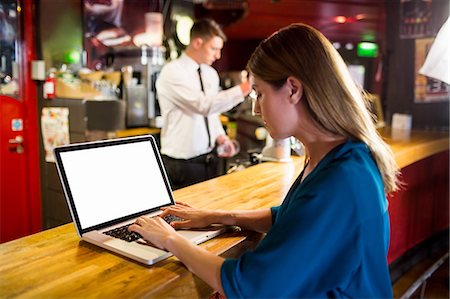 pint of beer - Serious businesswoman working on his laptop Stock Photo - Premium Royalty-Free, Code: 6109-08394925