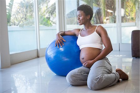 Black pregnant women exercise ball Stock Photos - Page 1 : Masterfile