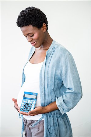 simsearch:6109-08395300,k - Smiling Pregnant woman holding a calculator Stockbilder - Premium RF Lizenzfrei, Bildnummer: 6109-08395265