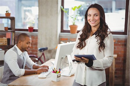 simsearch:6109-08581390,k - Confident businesswoman standing at office Photographie de stock - Premium Libres de Droits, Code: 6109-08395566