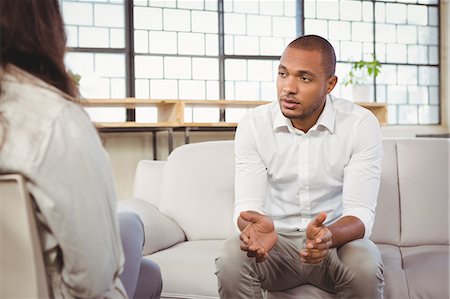 psychotherapy - Depressed patient talking with counselor Stock Photo - Premium Royalty-Free, Code: 6109-08395621