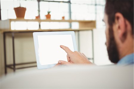 person touch screen - Close-up of man while using digital tablet Stock Photo - Premium Royalty-Free, Code: 6109-08395787