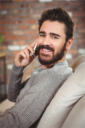 simsearch:6109-08390077,k - Portrait of happy man talking on smartphone Stock Photo - Premium Royalty-Free, Code: 6109-08395849