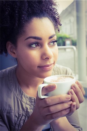 person drink cup of coffee - Pretty student having a coffee Stock Photo - Premium Royalty-Free, Code: 6109-08395868