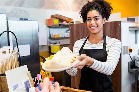 served - Waitress serving lunch to customer Stock Photo - Premium Royalty-Free, Code: 6109-08395954