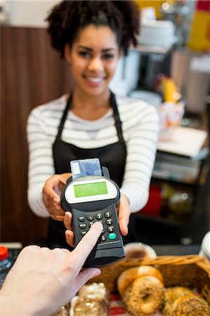 store owner beverages - Customer paying with credit card Stock Photo - Premium Royalty-Free, Code: 6109-08395961