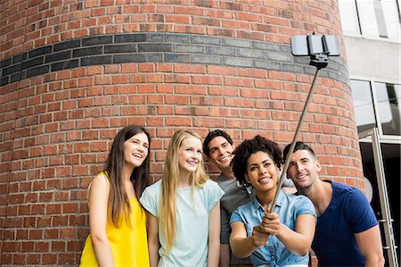friends taking a selfie - Students all taking selfie together Stock Photo - Premium Royalty-Free, Code: 6109-08396012