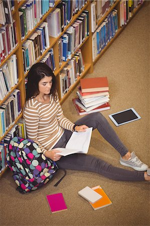 simsearch:400-04829236,k - High angle view of serious woman studying Stock Photo - Premium Royalty-Free, Code: 6109-08396199