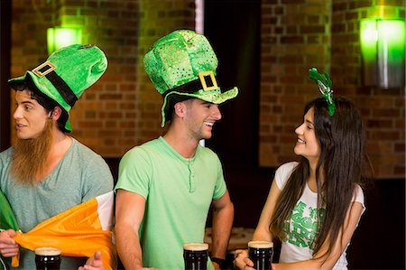 drinking beer pub - Friends celebrating st patricks day Stock Photo - Premium Royalty-Free, Code: 6109-08396120