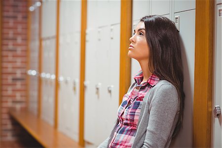 simsearch:6109-08396153,k - Worried student sitting on bench Foto de stock - Sin royalties Premium, Código: 6109-08396138