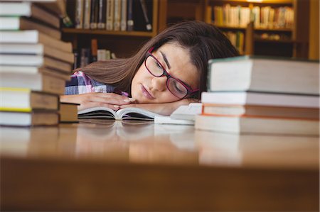 simsearch:632-03424212,k - Female student napping with head on book Photographie de stock - Premium Libres de Droits, Code: 6109-08396271