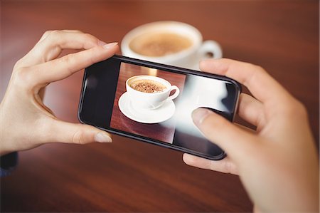 steamed milk - Woman having a cappuccino Stock Photo - Premium Royalty-Free, Code: 6109-08396457