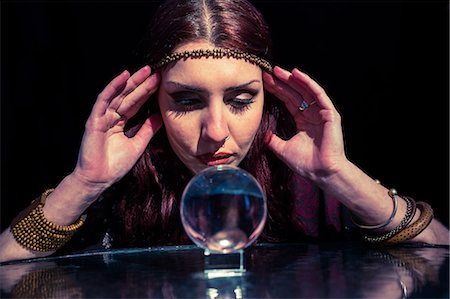 simsearch:400-04180986,k - Fortune teller using crystal ball with eyes closed Stock Photo - Premium Royalty-Free, Code: 6109-08396667