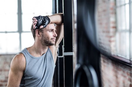 simsearch:6109-08396754,k - Fit man taking a break from working out Stock Photo - Premium Royalty-Free, Code: 6109-08396753