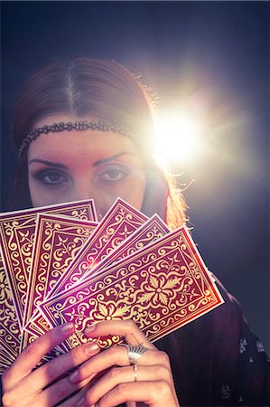 simsearch:6109-08396685,k - Portrait of fortune teller holding tarot cards bunch Stock Photo - Premium Royalty-Free, Code: 6109-08396706