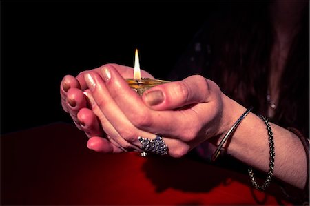 simsearch:6109-08396685,k - Female fortune teller woman holding candle Stock Photo - Premium Royalty-Free, Code: 6109-08396713