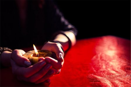 simsearch:6109-08396685,k - Close-up of fortune teller holding candle Stock Photo - Premium Royalty-Free, Code: 6109-08396715