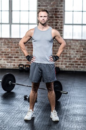 slim body - Fit man posing face to the camera Stock Photo - Premium Royalty-Free, Code: 6109-08396735