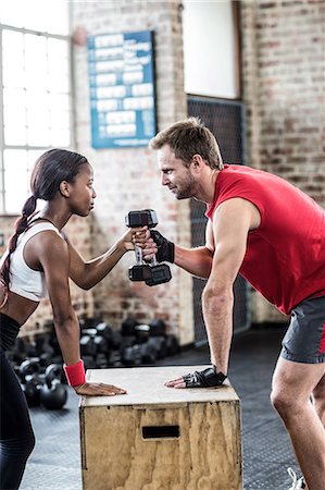 simsearch:6109-08397052,k - Muscular couple lifting weight together Stock Photo - Premium Royalty-Free, Code: 6109-08396854