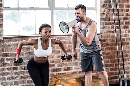 physique - Trainer yelling through the megaphone Stock Photo - Premium Royalty-Free, Code: 6109-08396891