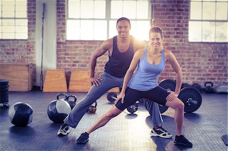 simsearch:6109-08397052,k - Fit couple doing stretching exercises Stock Photo - Premium Royalty-Free, Code: 6109-08397094