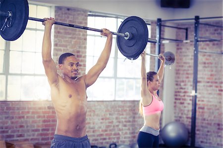 simsearch:6109-08396835,k - Fit couple lifting weight together Stock Photo - Premium Royalty-Free, Code: 6109-08397028