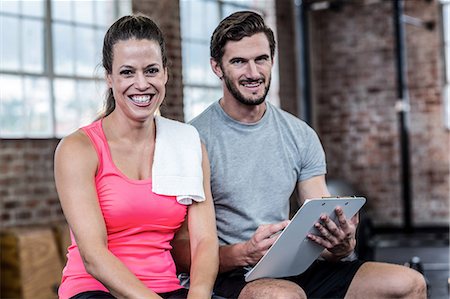 simsearch:6109-08397012,k - Fit woman discussing with personal trainer Stock Photo - Premium Royalty-Free, Code: 6109-08397171