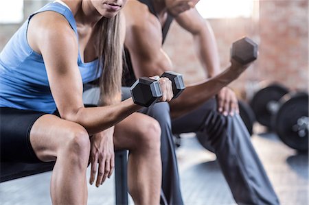 slim body - Fit couple doing dumbbell exercises Stock Photo - Premium Royalty-Free, Code: 6109-08397103