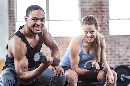 simsearch:6109-08397116,k - Fit couple doing dumbbell exercises Stock Photo - Premium Royalty-Free, Code: 6109-08397102