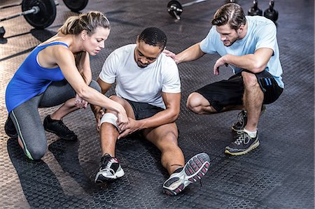 fitness class gym - Sporty man having a muscle injury Stock Photo - Premium Royalty-Free, Code: 6109-08397232