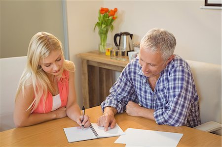 Creative business people discussing over notebook in office Foto de stock - Sin royalties Premium, Código: 6109-08397465