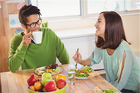 simsearch:6109-08397541,k - Business people having breakfast in creative office Stock Photo - Premium Royalty-Free, Code: 6109-08397411