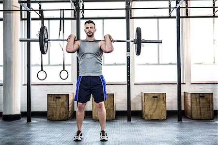 Fit man lifting heavy barbell Stock Photo - Premium Royalty-Free, Code: 6109-08397748