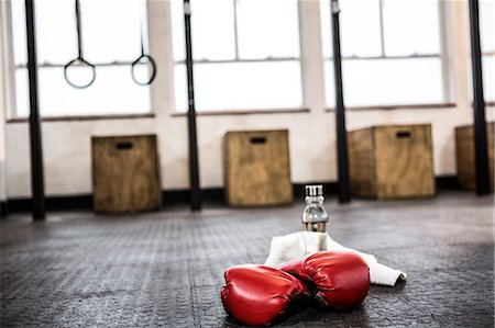 Boxing gloves on studio floor Stock Photo - Premium Royalty-Free, Code: 6109-08397717