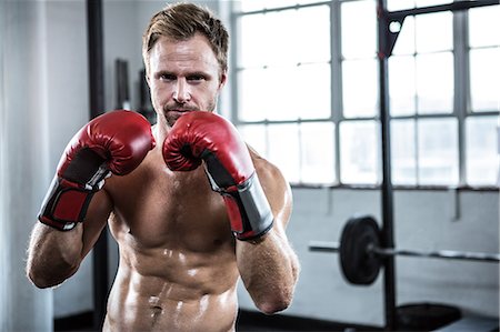 Fit man with boxing gloves Foto de stock - Sin royalties Premium, Código: 6109-08397862