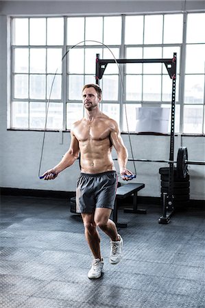 fit - Fit man using skipping rope Stock Photo - Premium Royalty-Free, Code: 6109-08397871