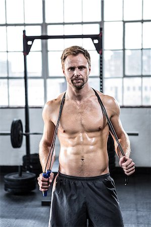 simsearch:6109-08398035,k - Fit man using skipping rope Stock Photo - Premium Royalty-Free, Code: 6109-08397872