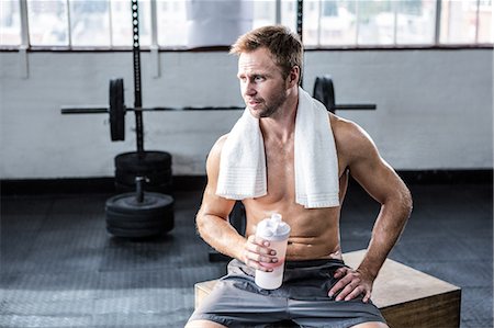simsearch:6109-08397871,k - Fit man drinking his protein shake Stock Photo - Premium Royalty-Free, Code: 6109-08397884