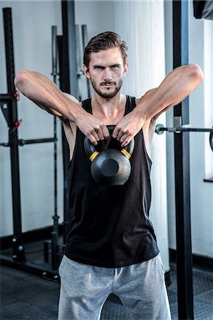 simsearch:6109-08397968,k - Fit man working out with kettlebell Stock Photo - Premium Royalty-Free, Code: 6109-08397962