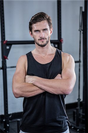 fitness man portrait not woman not group - Fit man with arms crossed Stock Photo - Premium Royalty-Free, Code: 6109-08397968