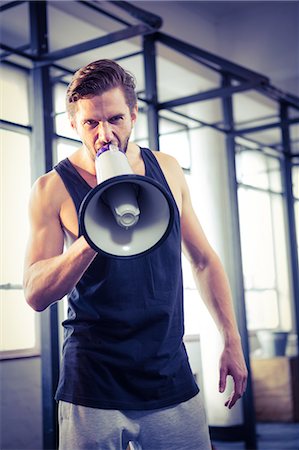 simsearch:6109-08398105,k - Fit trainer shouting through megaphone Stock Photo - Premium Royalty-Free, Code: 6109-08397984